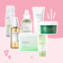 K-beauty bundle with Centella-based cleansers, serums, and toner pads from iUNIK, SKIN1004, AXIS-Y, and Mixsoon on pink background