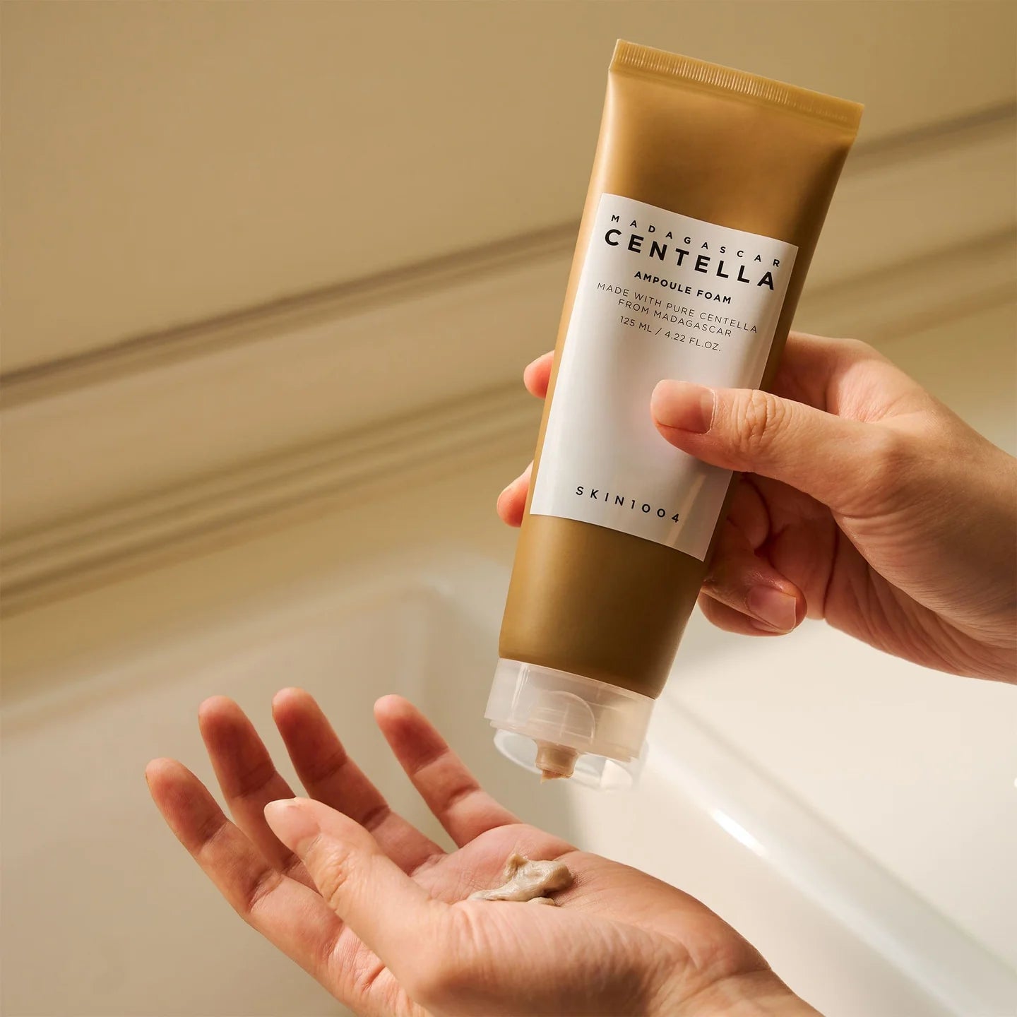 SKIN1004 Madagascar Centella Ampoule Foam being dispensed into hand