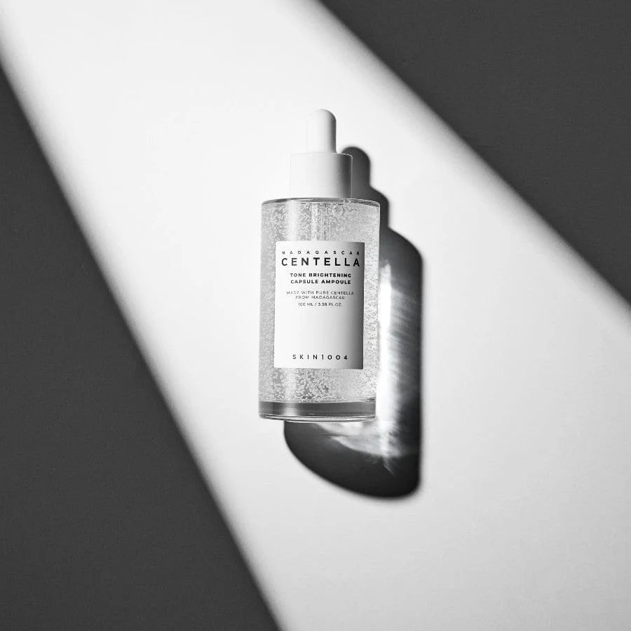 SKIN1004 Centella Tone Brightening Capsule Ampoule in dramatic black and white lighting