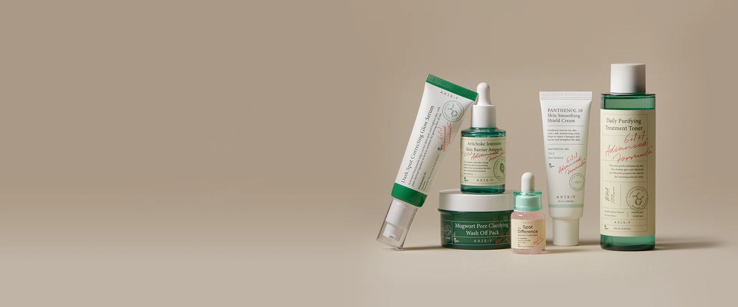 Flat lay of AXIS-Y Korean skincare products including toner, ampoule, and cream for acne-prone and sensitive skin, featured at The Koko Collection.