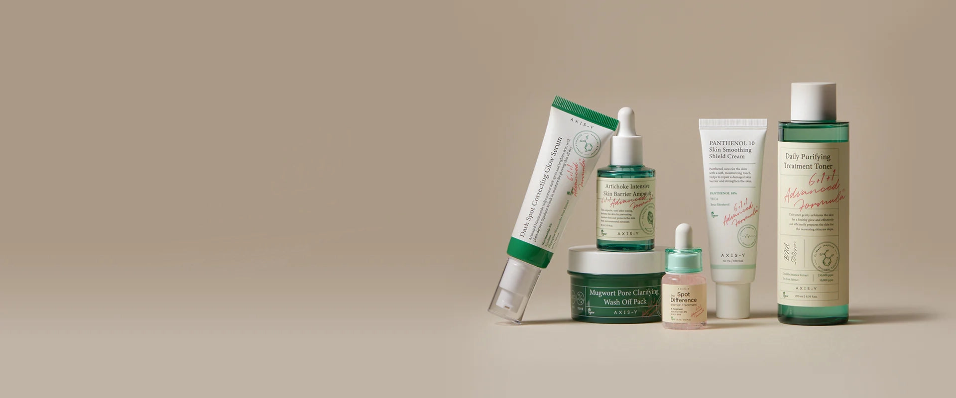 Flat lay of AXIS-Y Korean skincare products including toner, ampoule, and cream for acne-prone and sensitive skin, featured at The Koko Collection.