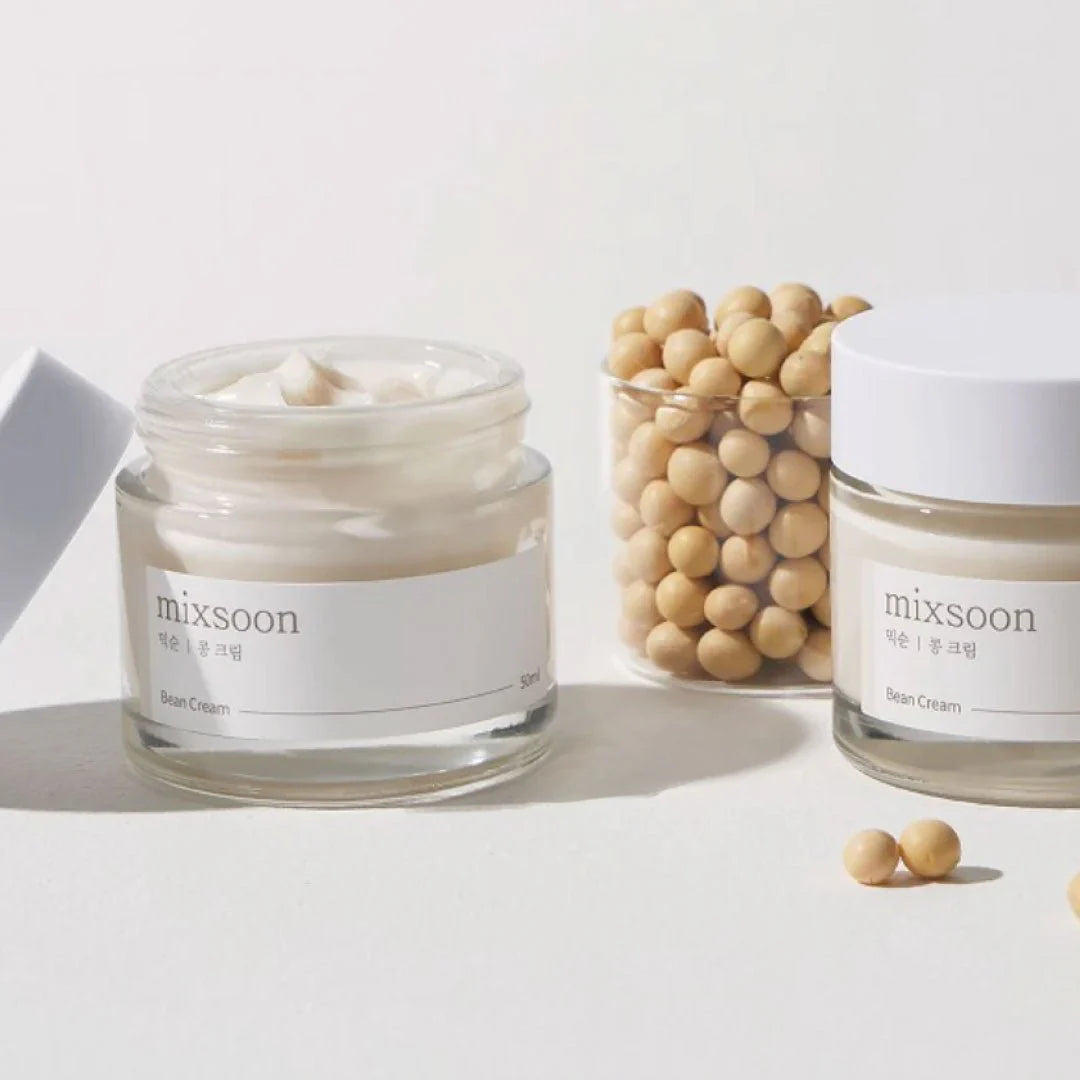 Mixsoon Bean Cream displayed with soybeans, highlighting its nourishing formula inspired by natural fermented ingredients.