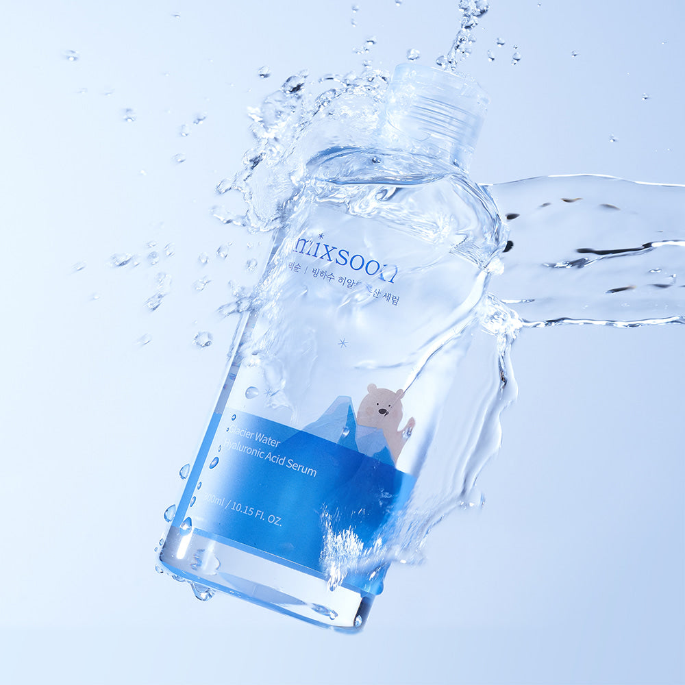 Mixsoon Glacier Water Hyaluronic Acid Serum splashing in water, highlighting its hydrating and refreshing benefits.