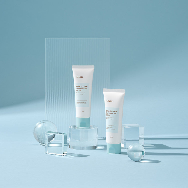 iUNIK Beta-Glucan Daily Moisture Cream displayed in a minimal blue setting – Korean moisturizer for deep hydration and skin barrier support.