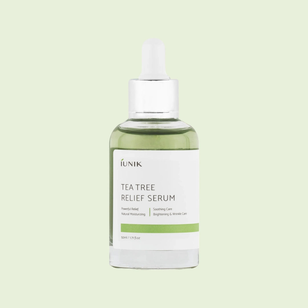 iUNIK Tea Tree Relief Serum with dropper dispensing product – calming Korean serum for acne-prone, sensitive skin.