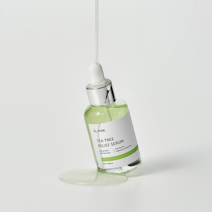 iUNIK Tea Tree Relief Serum with dropper dispensing product – calming Korean serum for acne-prone, sensitive skin.